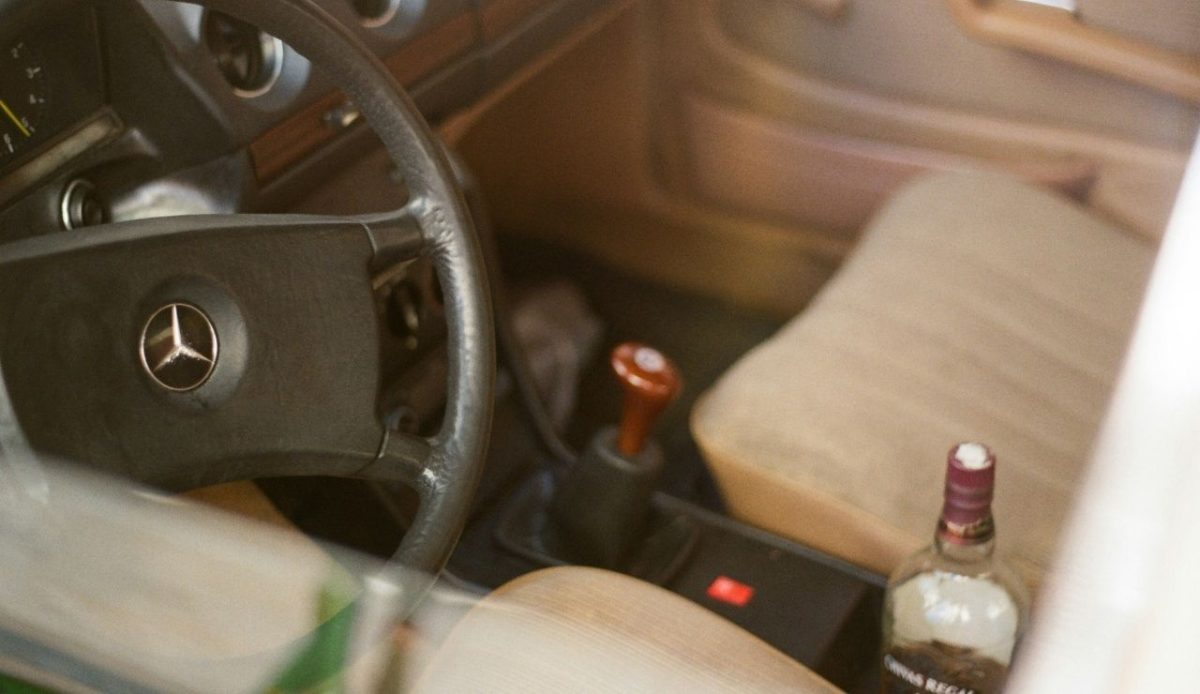 Alcohol bottle inside a vehicle             