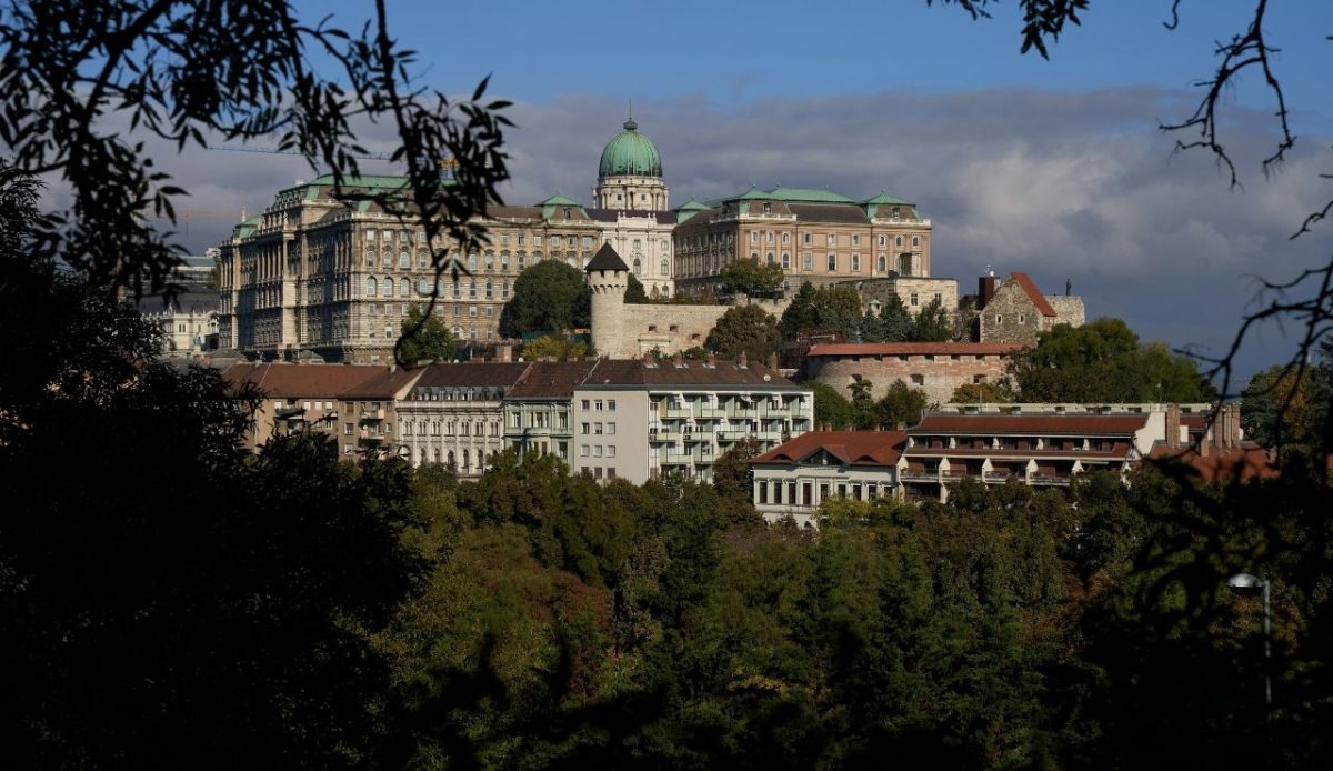 8 Must Visit Spots to Add to Your Hungary Travel List 1 Buda Castle photographed from the autumn trees of Gellért Hill Budapest, Hungary