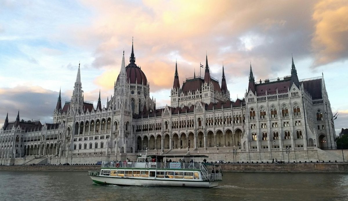 Budapest Parliament seen from a Danube boat cruise on sunset            