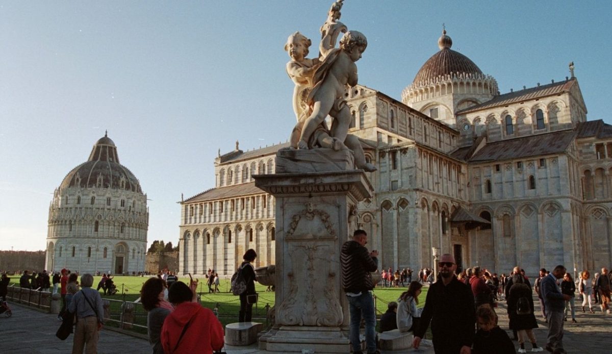 Crowds at Piazza dei Miracoli near the Baptistery and Cathedral in Pisa, Italy                