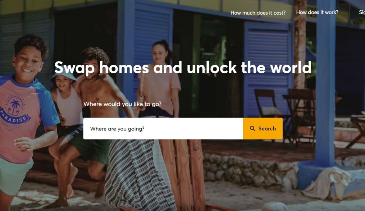 HomeExchange website banner showing family at a vacation home near the beach            