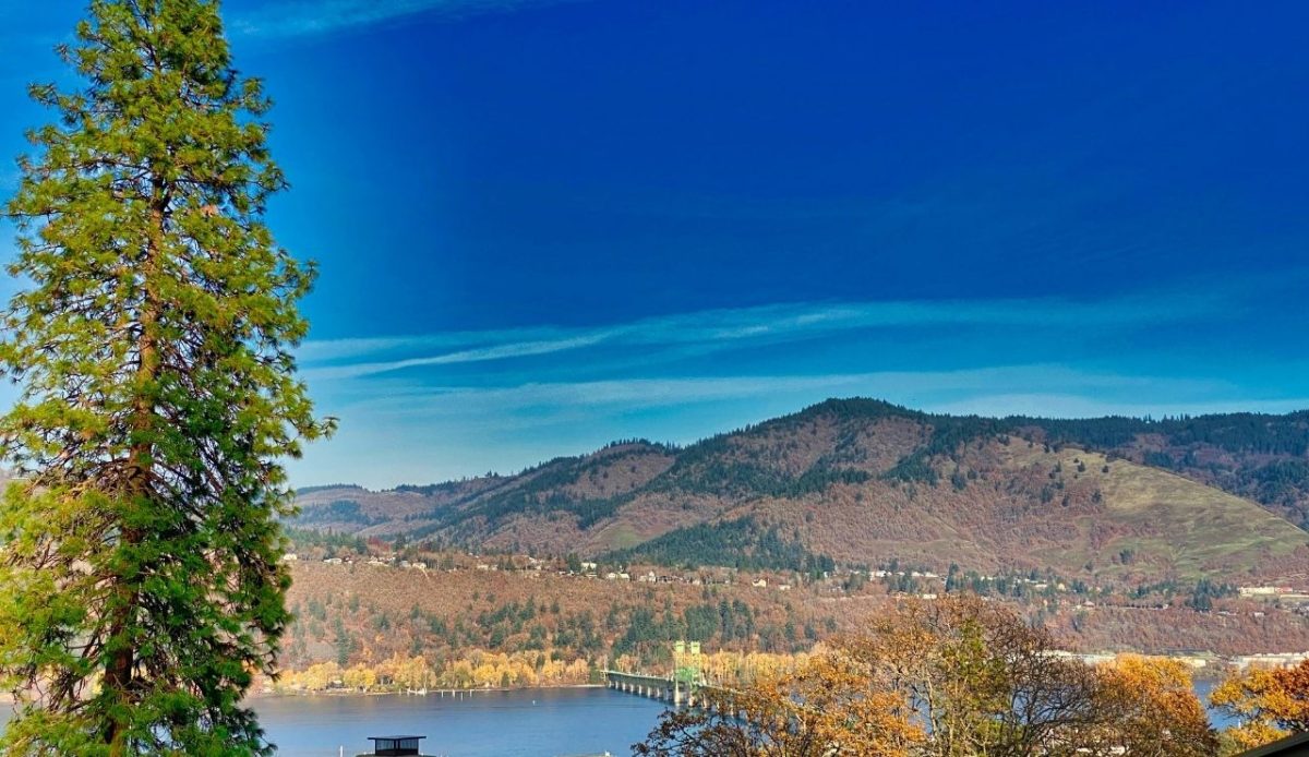 Hood River Bridge over Columbia River with fall hills in Oregon