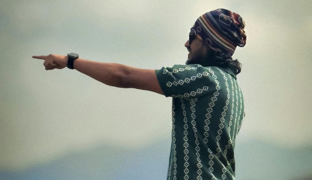 Man Pointing Towards Scenic View in Munnar (fake guide)              