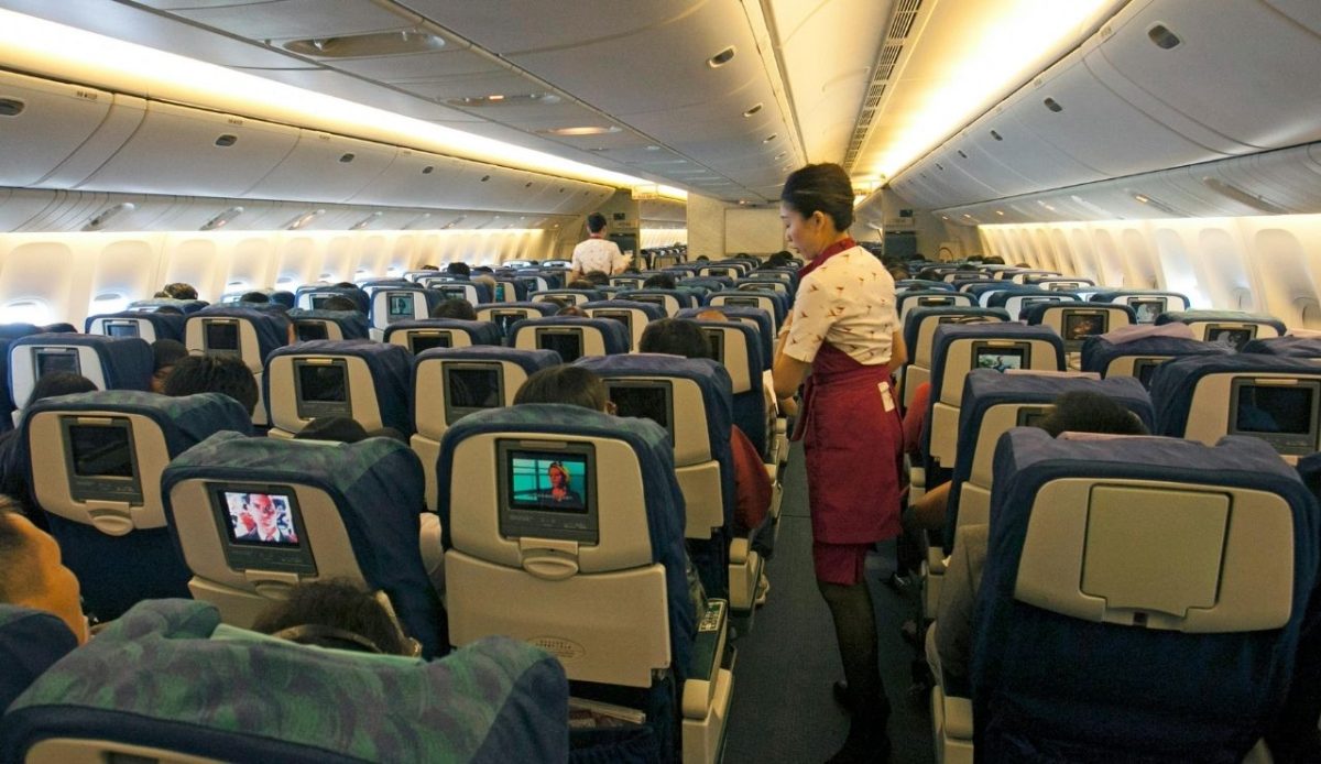 Stewardess Working on Airplane         