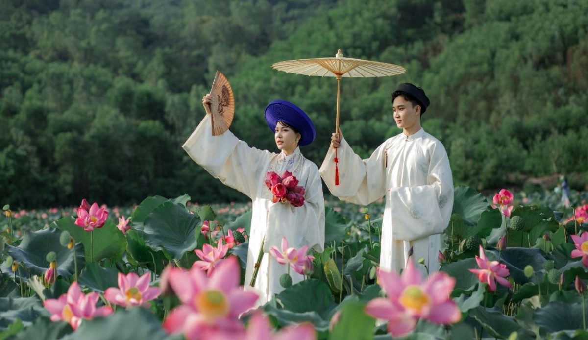 Traditional Vietnamese Attire (local dress) in Lotus Field                    