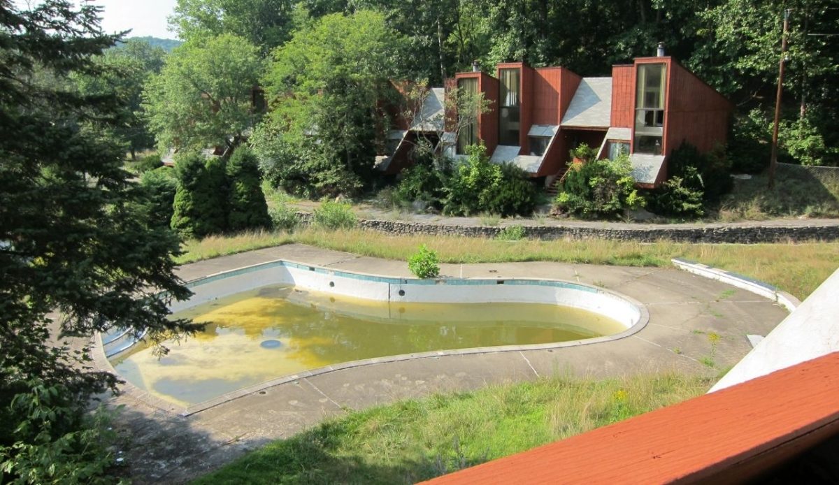 View of the Penn Hills Resort pool, shaped like a wedding bell, suffering neglect after the resort was abandoned. August, 2012             