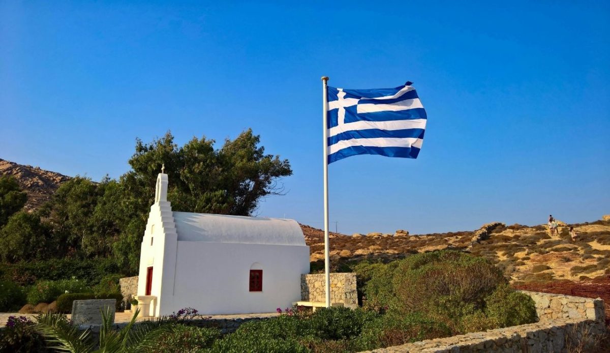 White Church with Greek Flag on Ios Island             