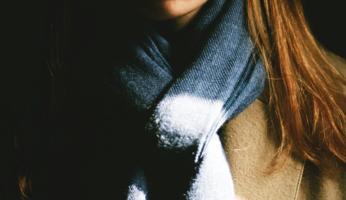 Woman wearing a big scarf      