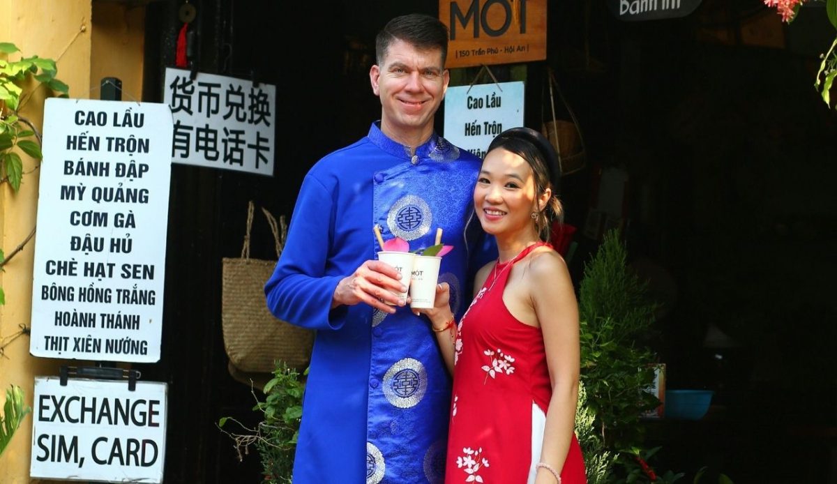 a White man with woman in local dress                