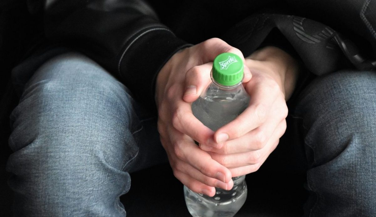 a man with drink in his hand                       