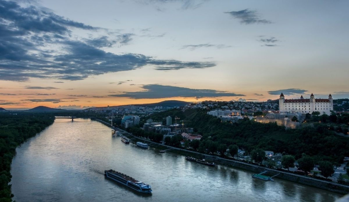 Sunset view of the Danube River and Bratislava Castle in Bratislava, Slovakia                 