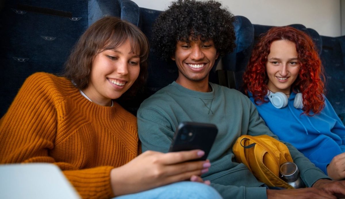 three people in plane talking with each other                             