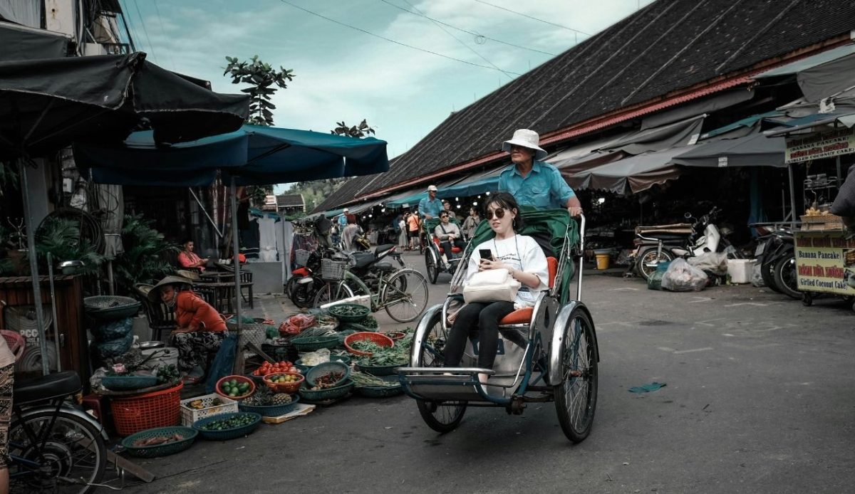 woman sitting on stroller, Hội An, Quang Nam Province, Vietnam                     