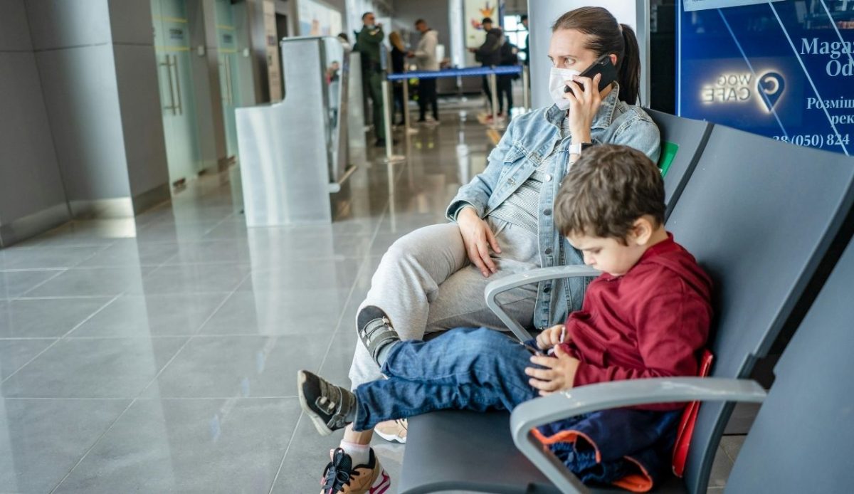 Mother and Son Waiting at the Airport                  