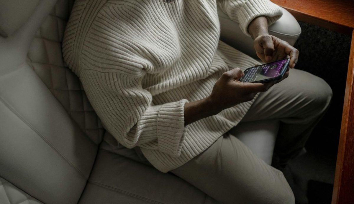 A Man Using His Cellphone While in an Airplane                                 