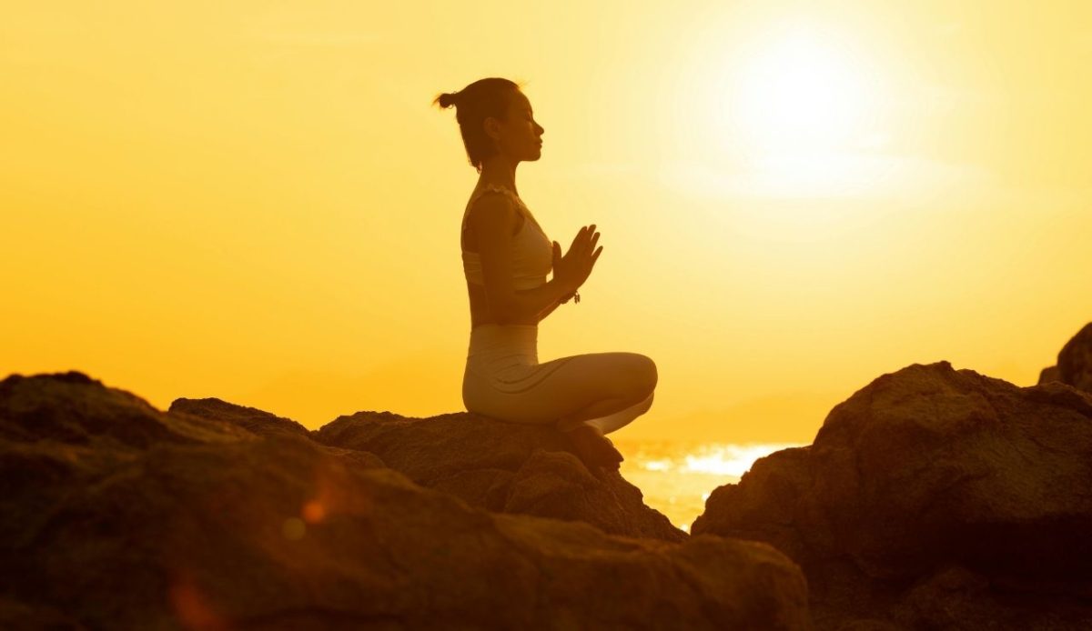 A Woman Doing Yoga During Golden Hour                  