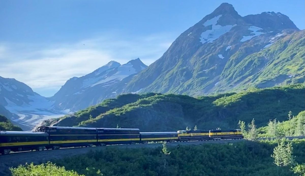 Alaska Railroad’s Coastal Classic Train traveling through the Kenai Mountains near Anchorage, Alaska, United States