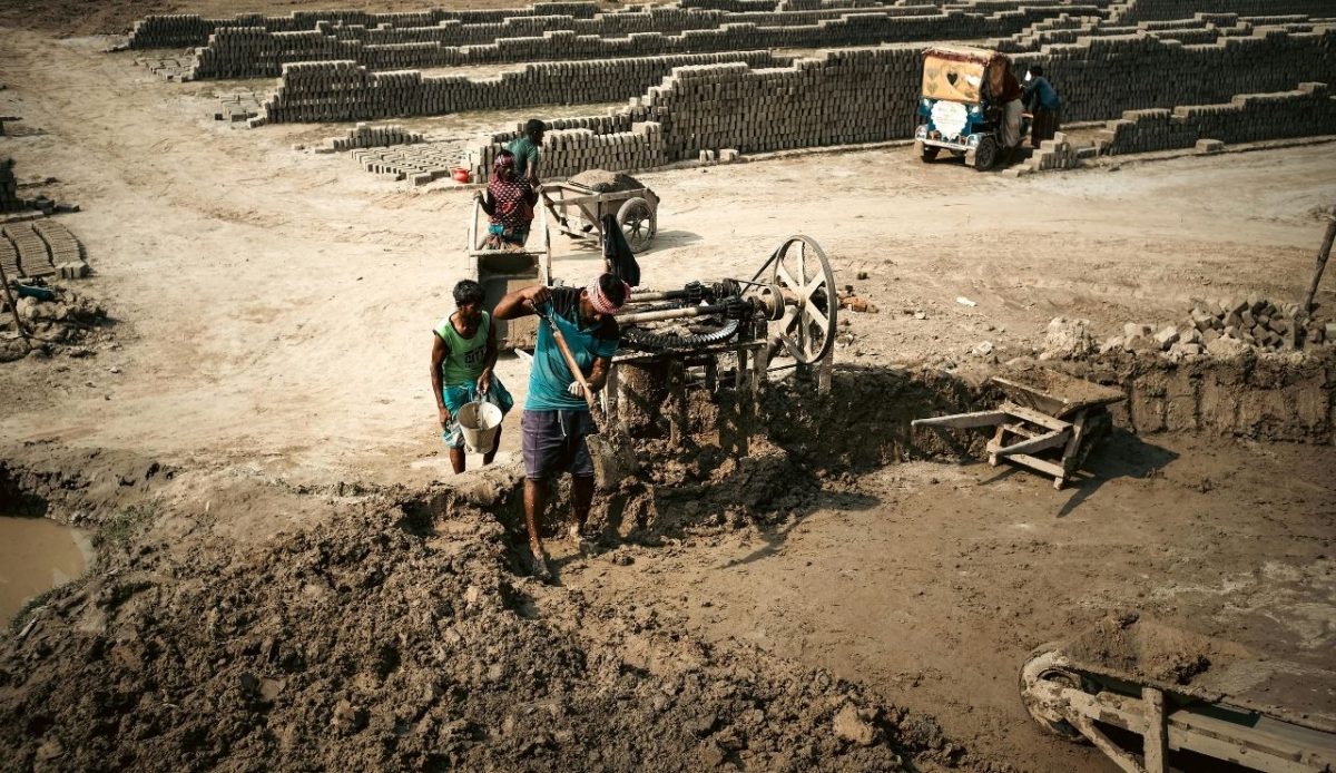 Manual Laborers in a Mudbrick Factory Setting             