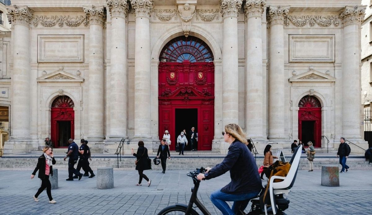 People Passing Near a White Building Close-up Photography, Copenhagen, Denmark         