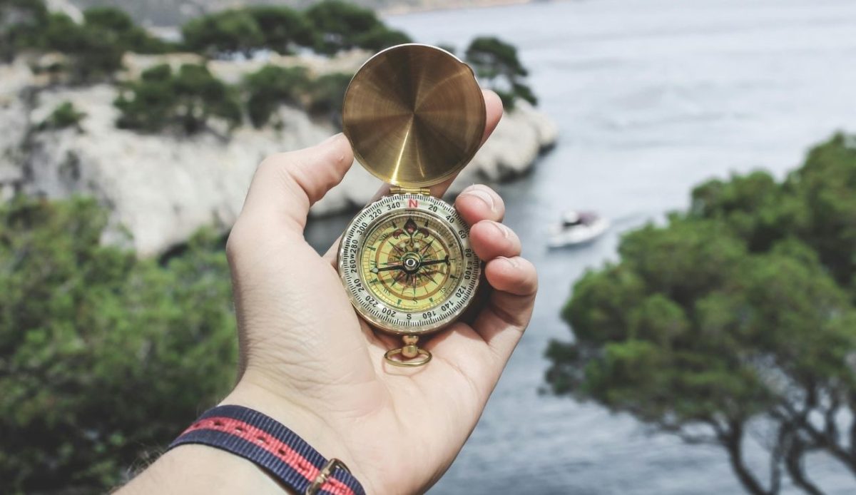 10 Essential Hiking Skills You Need Before Tackling Serious Trails 1 Person Holding Compass