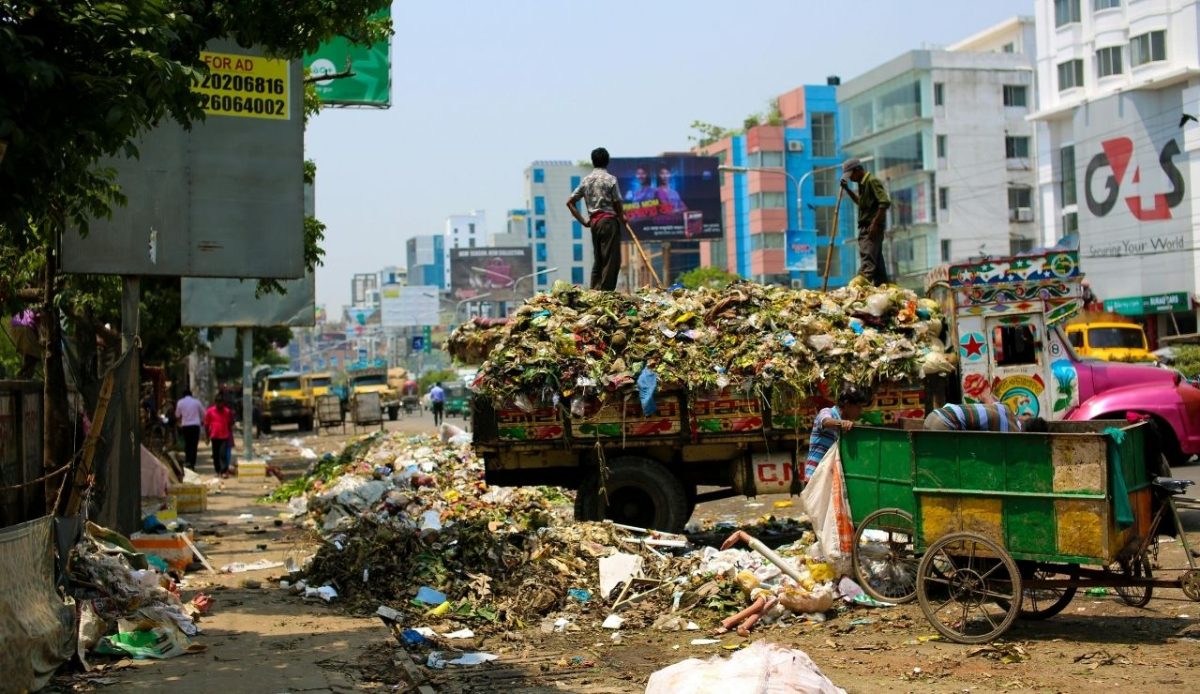 Photo of a Dump Truck Across Buildings, Dhaka, Bangladesh                     