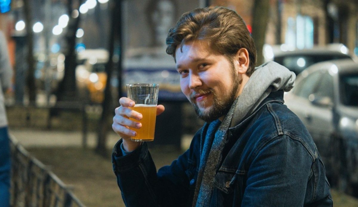 Photo of a Man with a Beard Holding a Glass of Beer                    