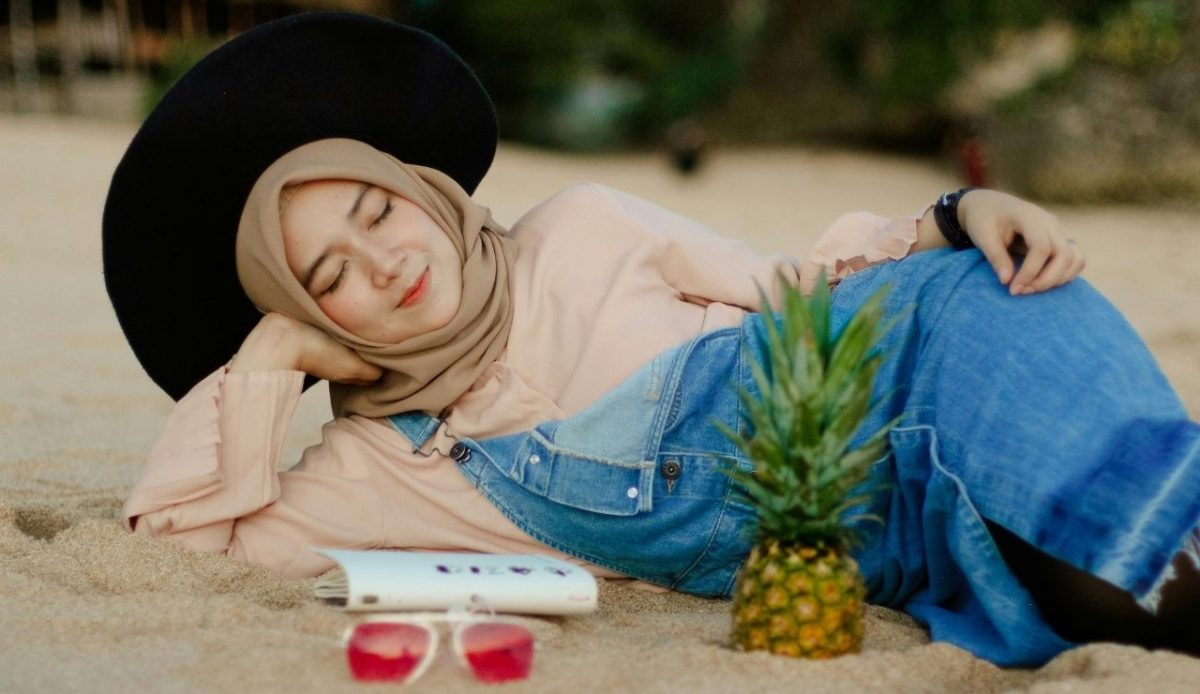 Woman in Blue Denim Dungaree Lying on Sand                    
