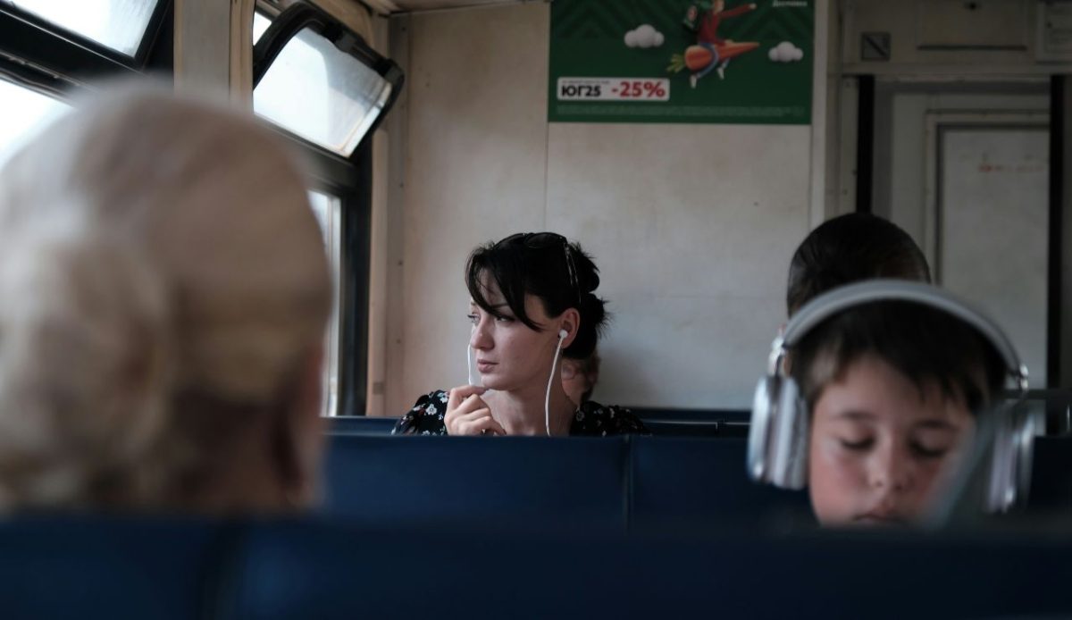a group of people using headphone