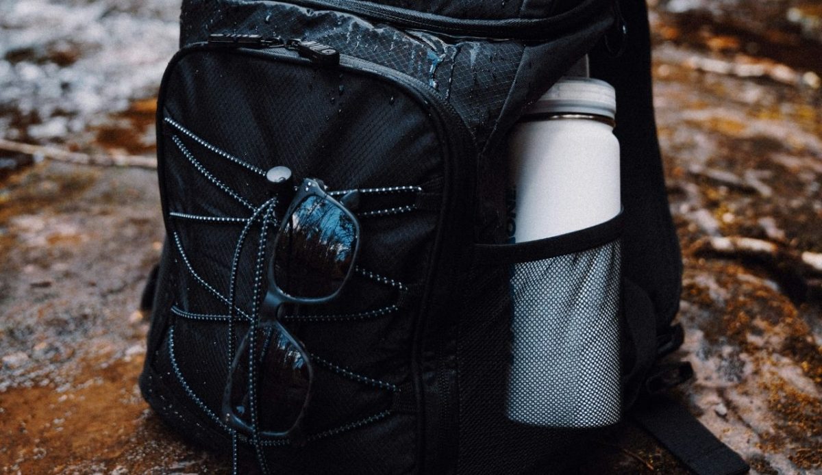 10 Essential Hiking Skills You Need Before Tackling Serious Trails 4 a hiker's bag with water bottle