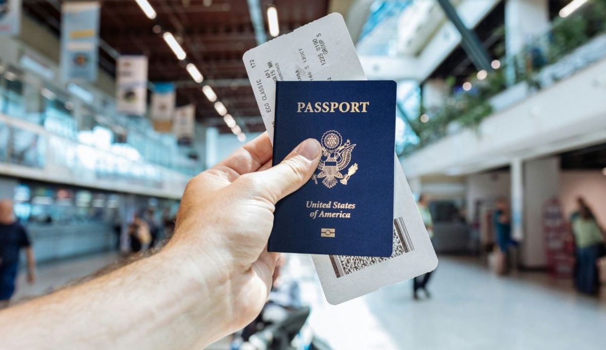 a man with passport in his hand