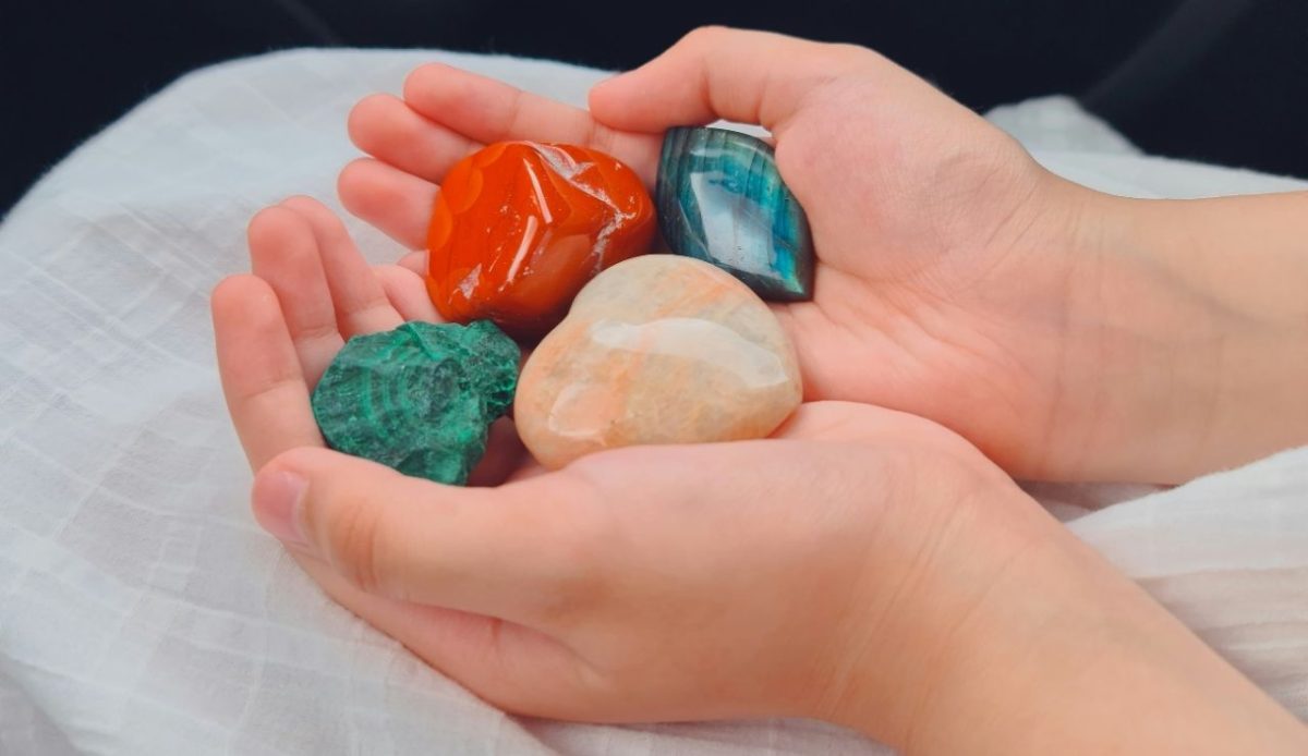 a person is holding artificial gemstone (fake gemsotone)                      
