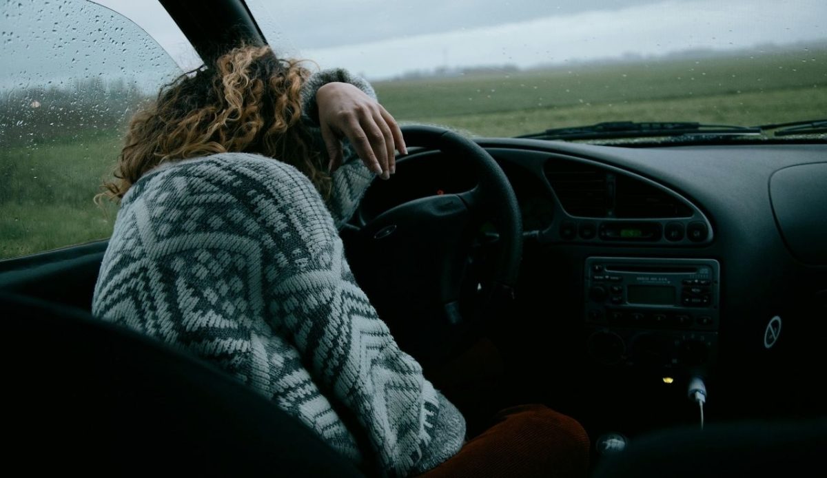 a woman driver in fatigue position                   