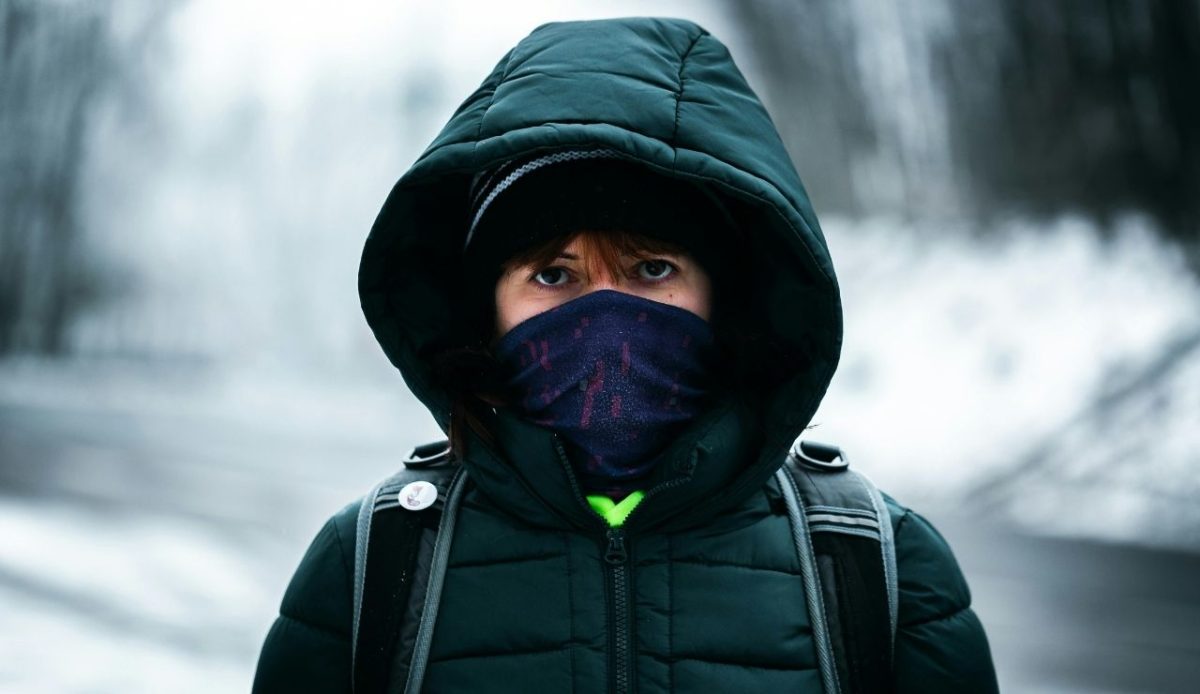 10 Essential Hiking Skills You Need Before Tackling Serious Trails 6 a woman in black hoodie jacket wearing mask