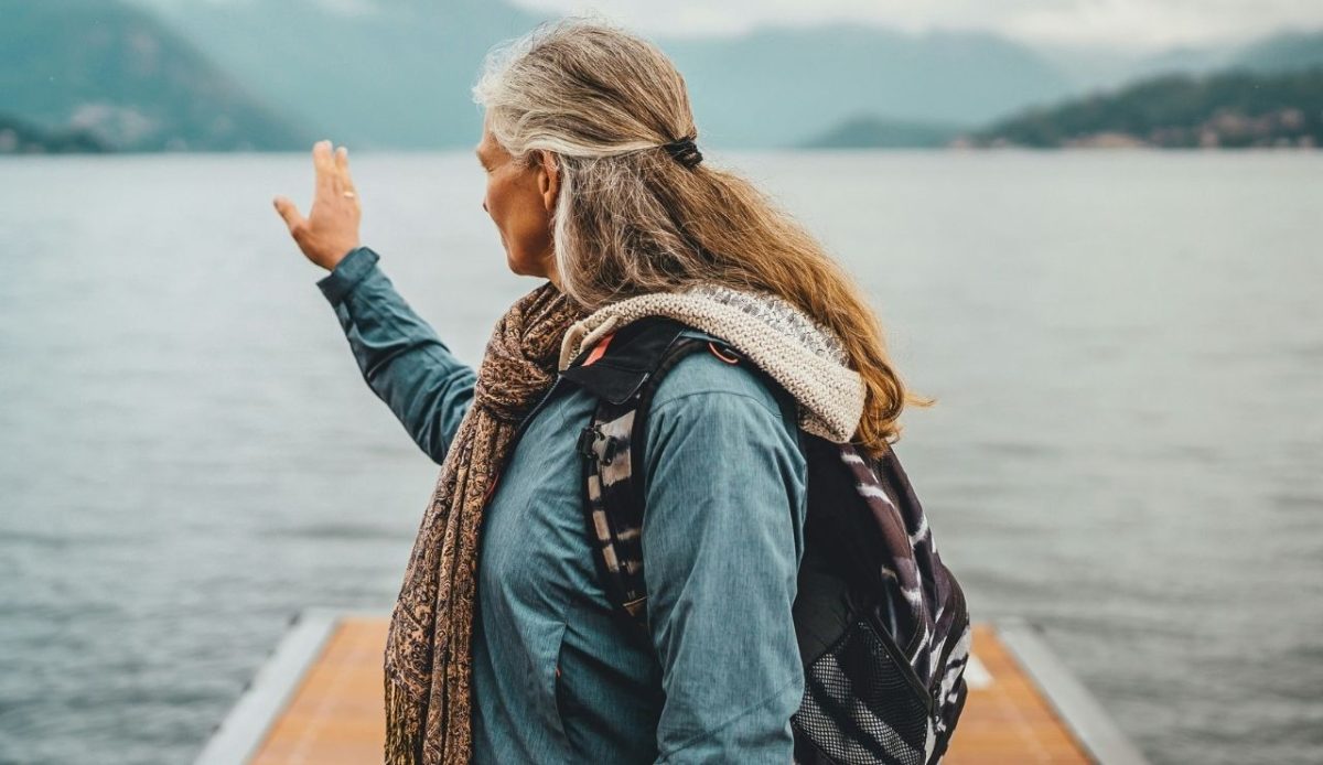 a woman is pointing someone with full hand               