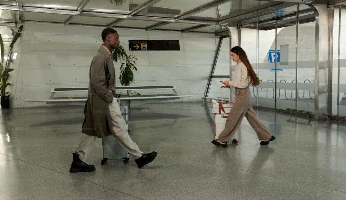 couple crossing each other at airport                  