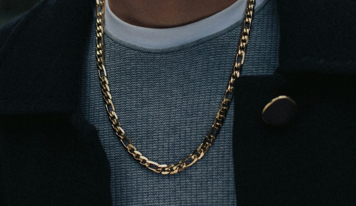 man is wearing gold chain                 