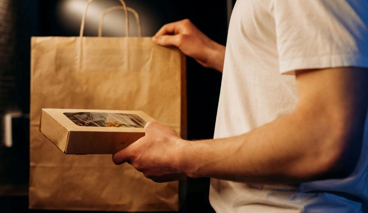 a traveler with food box in his hand                        