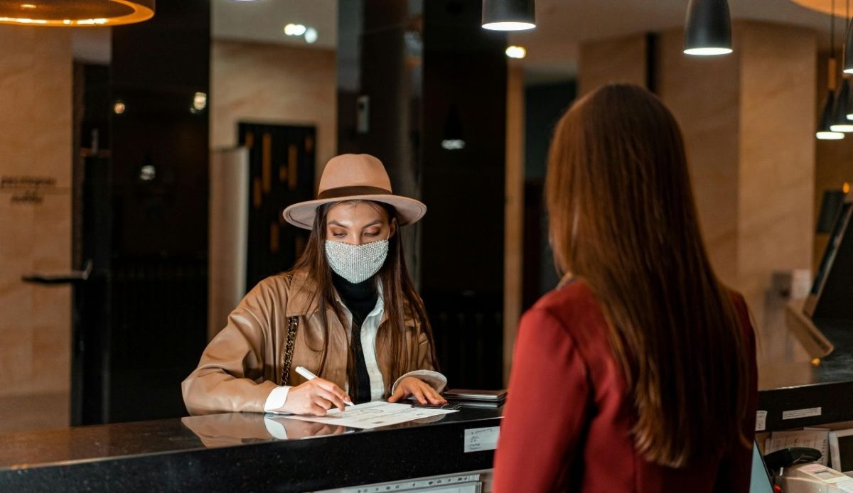 A Woman traveler in the Front Desk of hotel                            