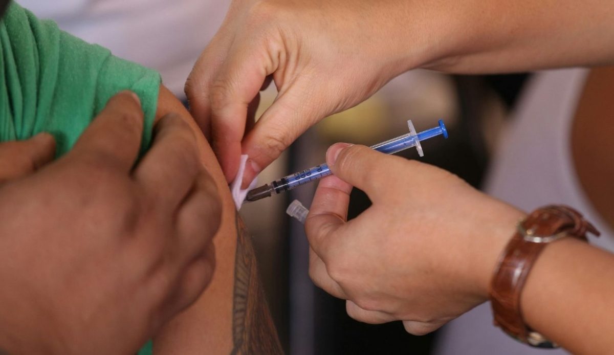 Close-up Photo of Injecting of Medicine on a Person                           