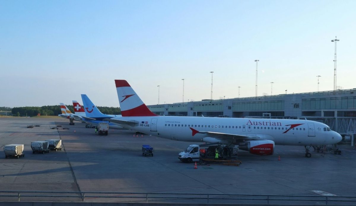 Commercial Airplanes at Oslo Airport Terminal                      