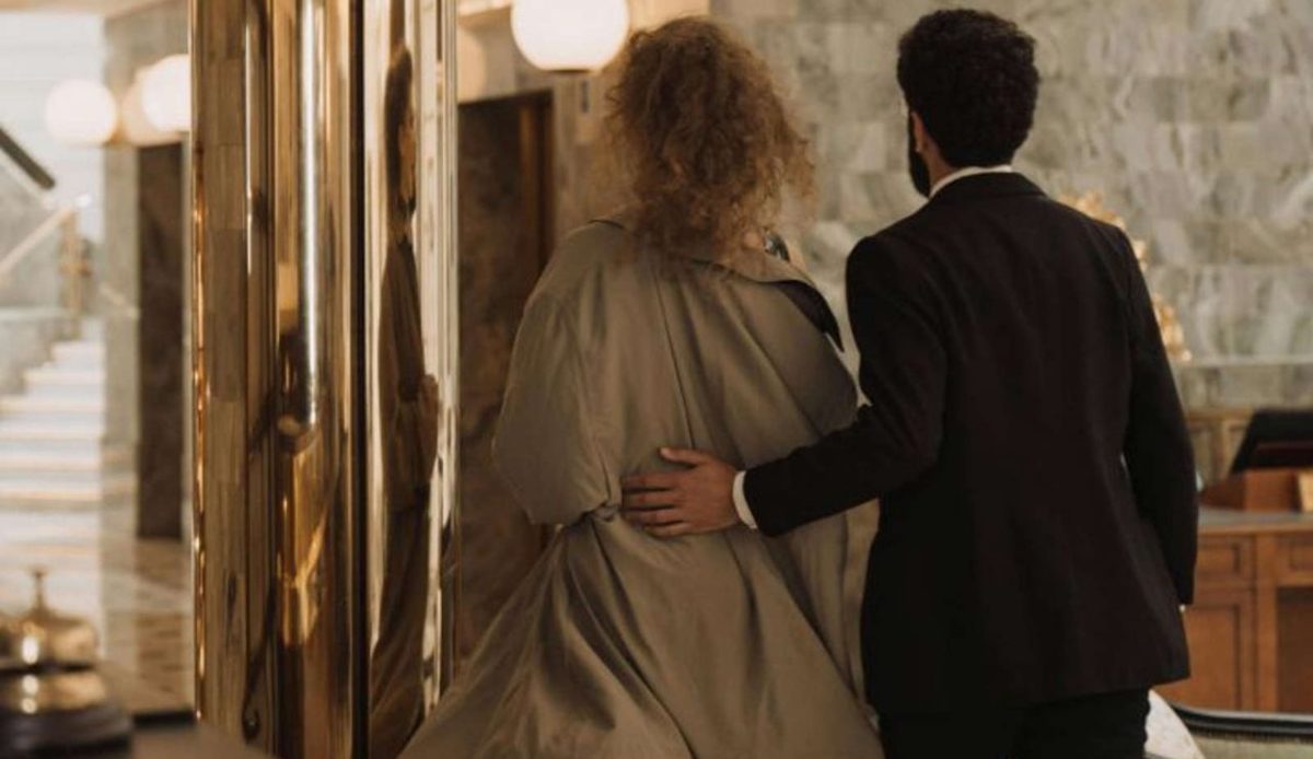 Couple walking through a hotel lobby