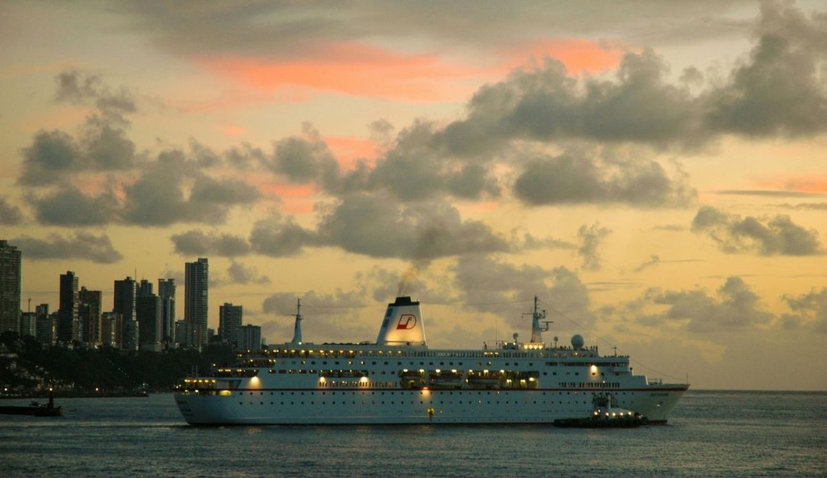 10 Sunny South American Destinations That Stay Warm All Year 10 Cruise ship near Salvador skyline at sunset, State of Bahia, Brazil