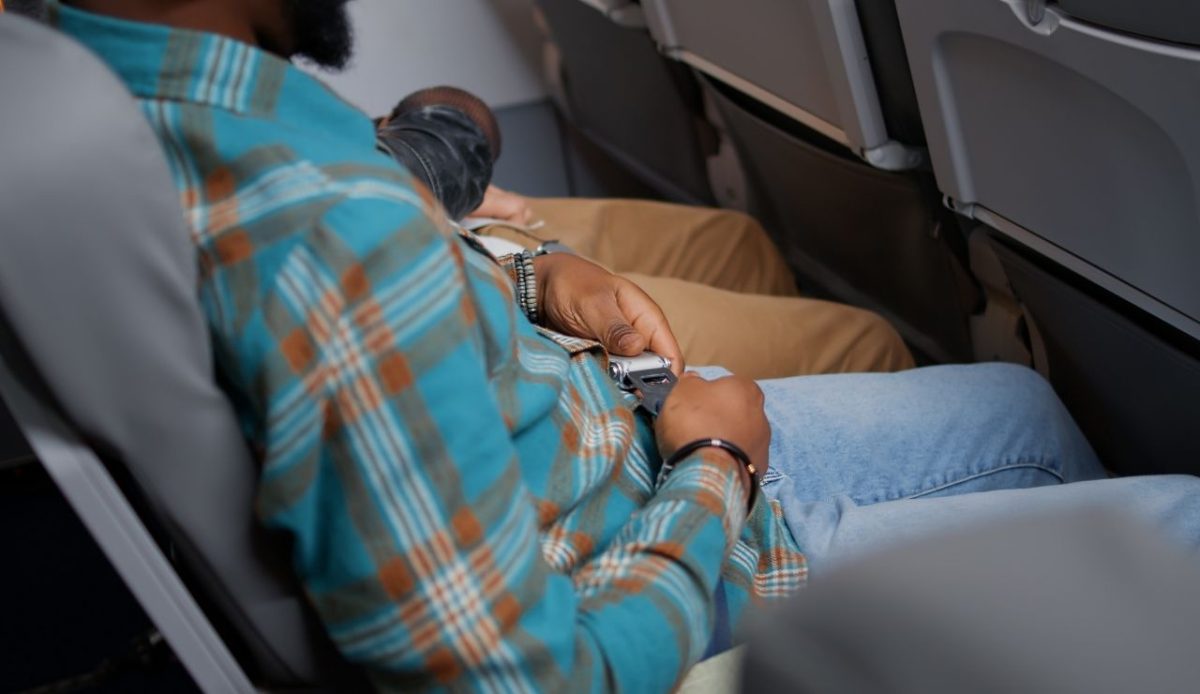 Male passenger bucking safety seatbelt with strap and lock                       