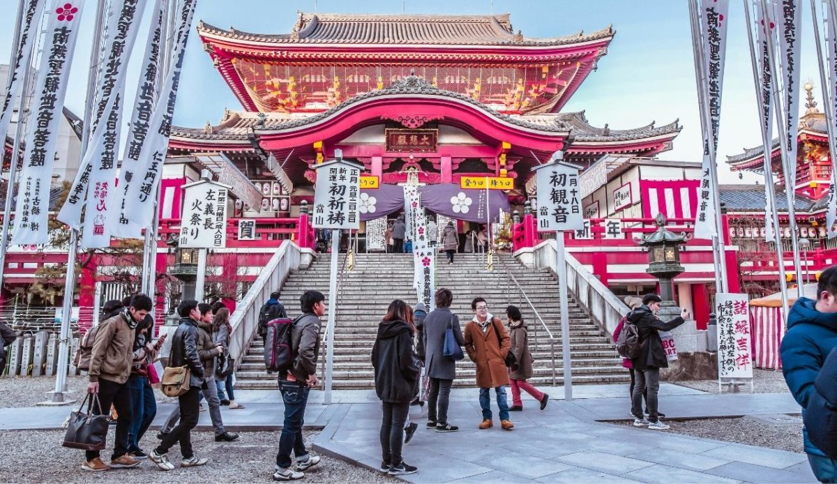 11 Countries That Are Perfect for Epic Cultural Road Trips 9 Nagoya, Japan, Group of People Gathered on Street Near Temple