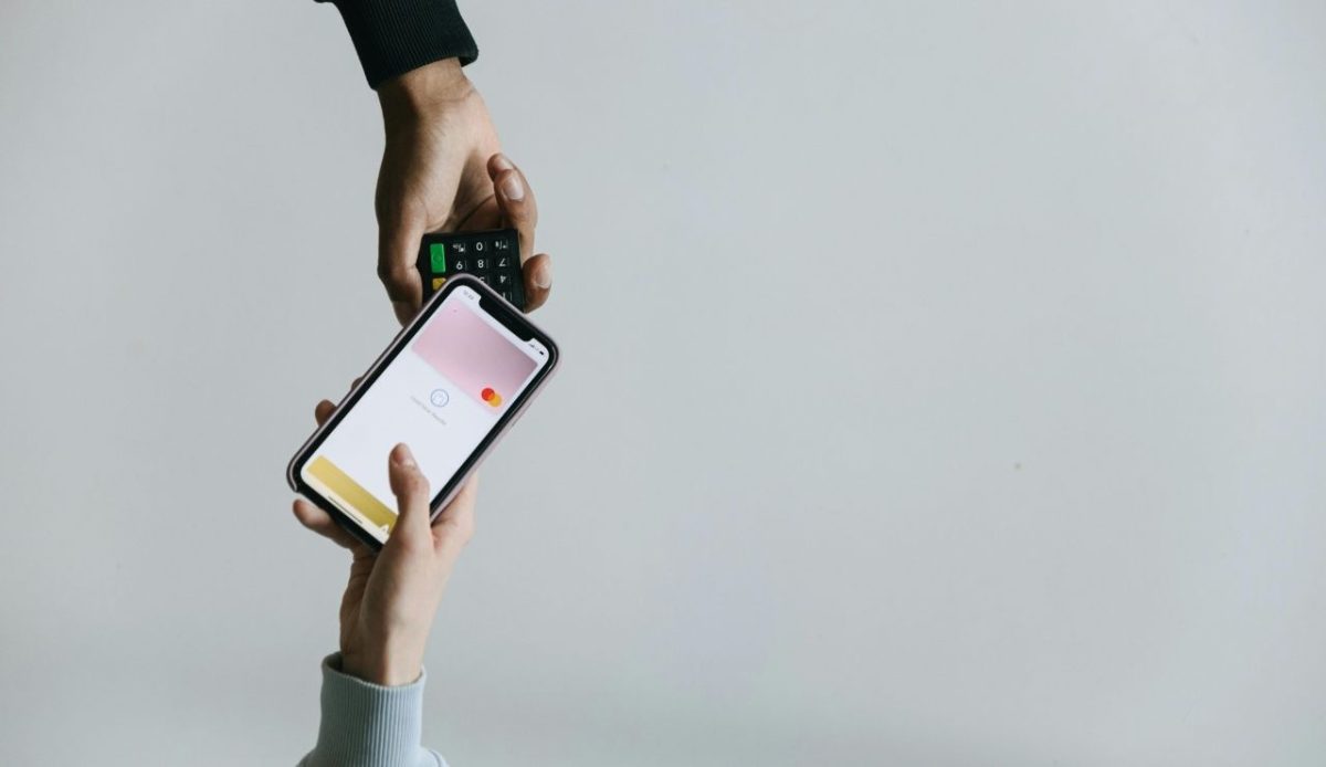 A Person Paying or transfering using a Smartphone                   