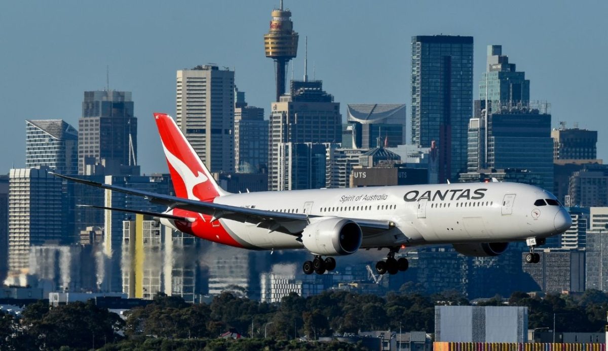 Qantas Boeing 787 Dreamliner landing with Sydney city skyline in background