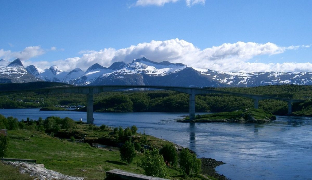 Saltstraumen and the Saltstraumen Bridge with the Børvasstindene mountains in the background                       