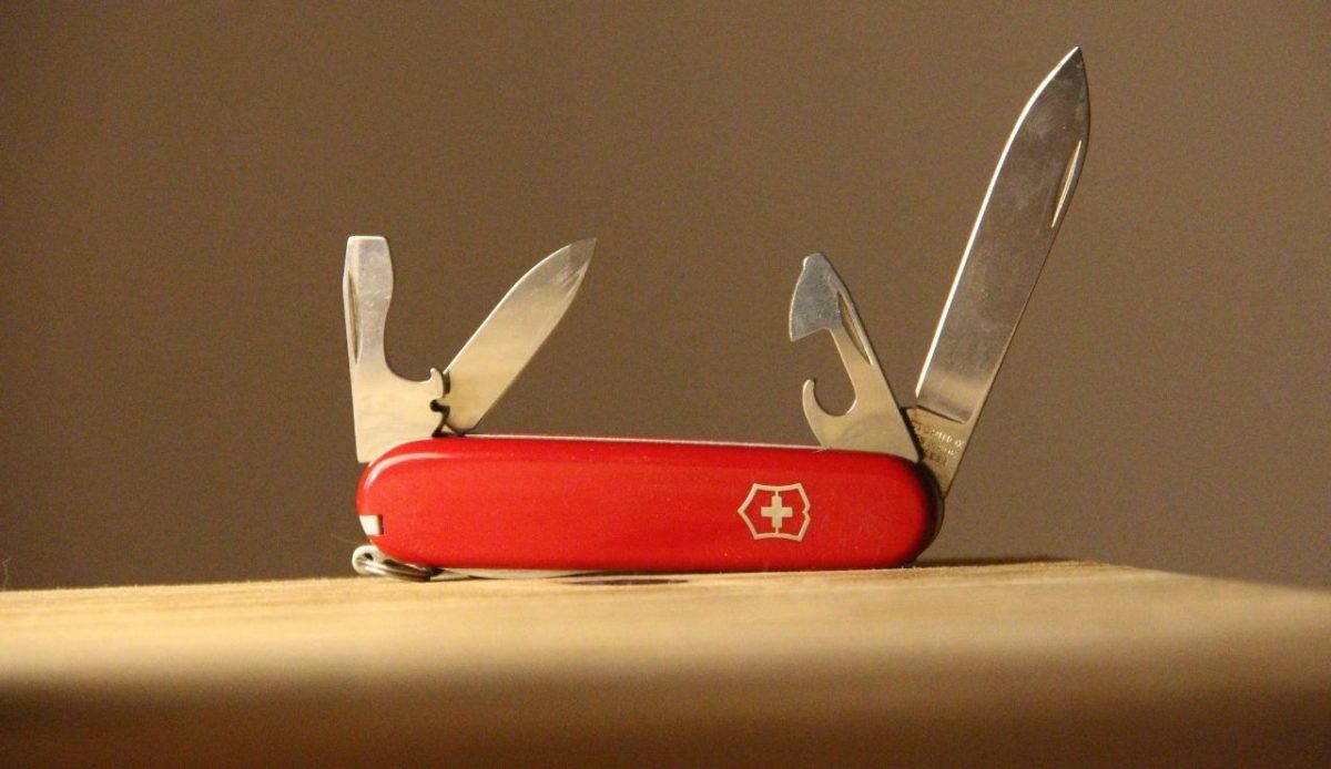 Swiss pocket knife on our Woden table                   