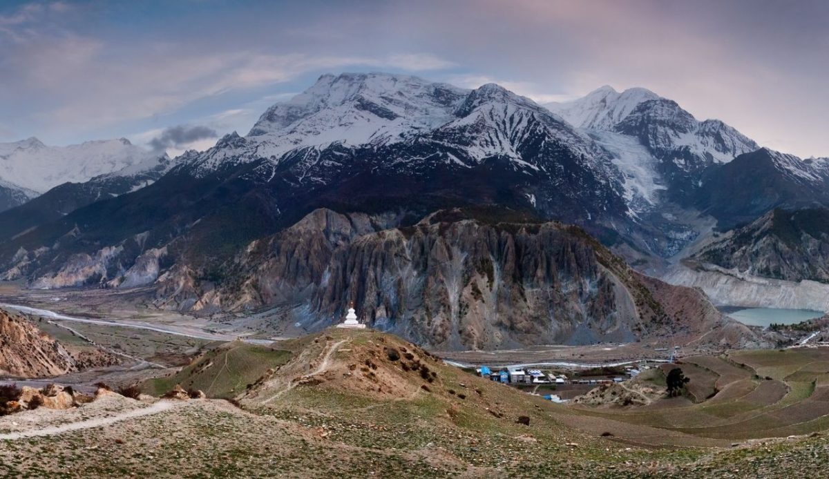 14 High-Altitude Regions Where Survival Depends on Preparation 4 View of Annapurna massif and village of Manang and Gangapurna Lake, Nepal
