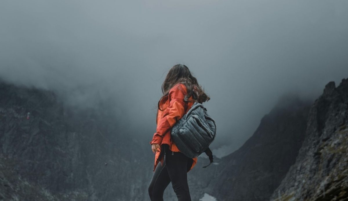 12 Seasonal Hiking Goals to Make 2026 Your Best Outdoor Year Yet 8 a woman hiker watching bad weather